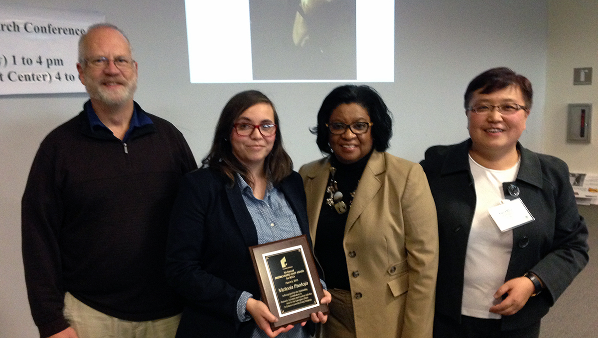 Group photo of awardee and other people. From left to right: Bruce Kennedy, Victoria Pantoja, President Soraya Coley, and Dr. Yao Olive Li