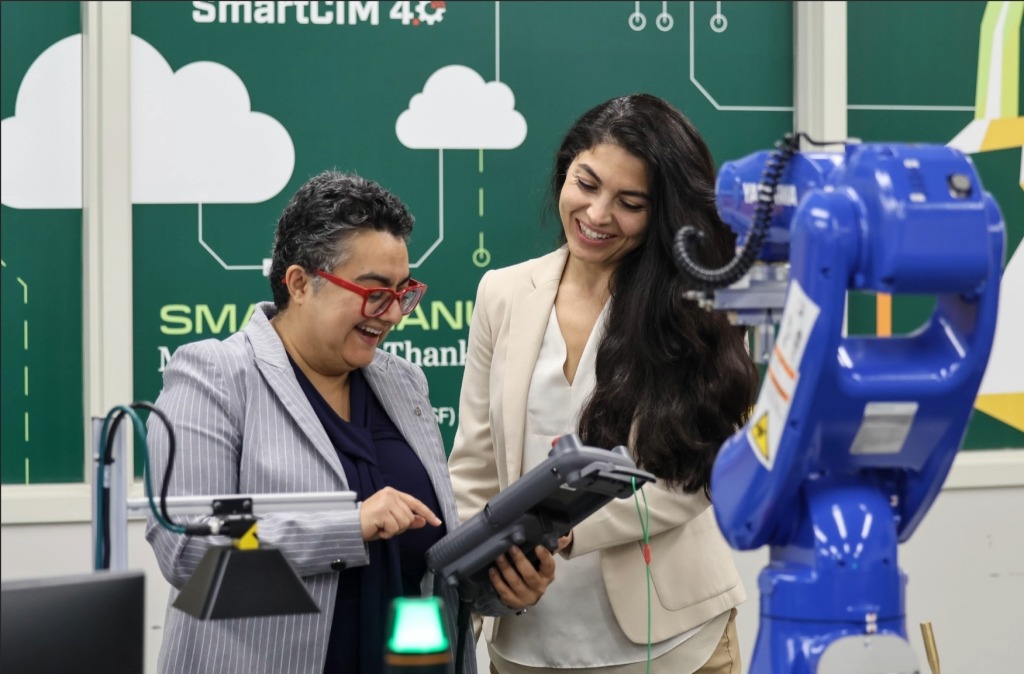 Image of two faculty in the lab