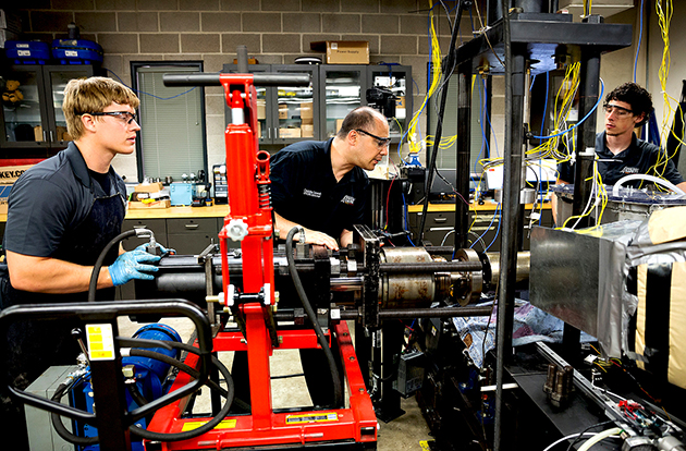 Three students working in the lab