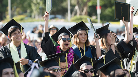 Group of graduates celebrate during commencement