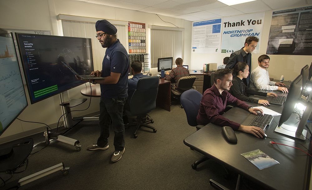 students working in the SOC room.