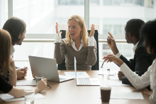 Women becoming overwhelmed in group meeting