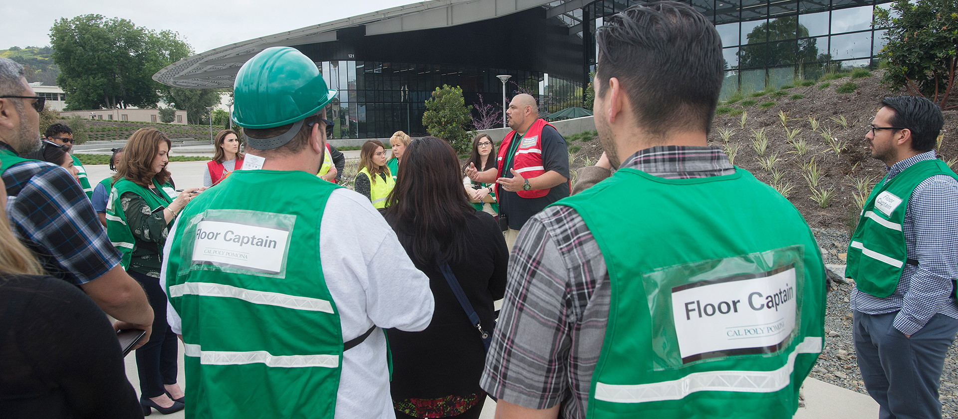 emergency management coordinator Ernie Fierro speaks to floor captains