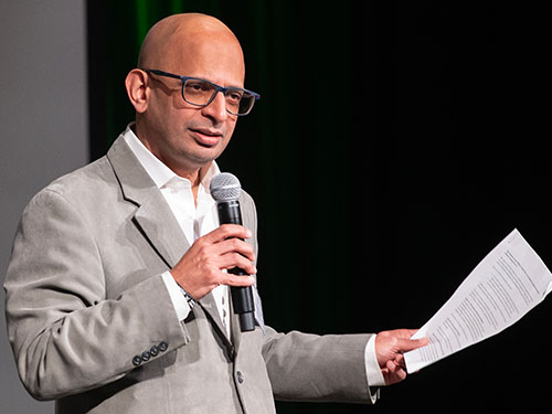 Sandeep Krishnamurthy speaks on stage