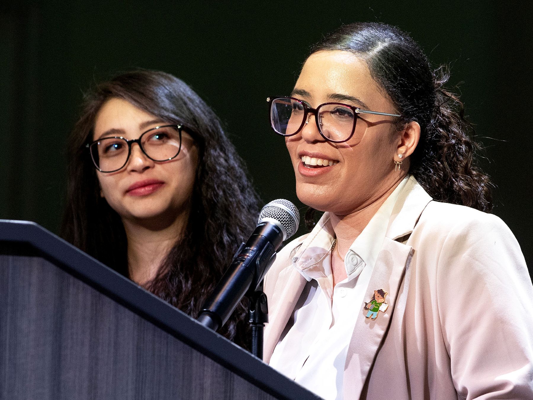 two presenters standing next to each other