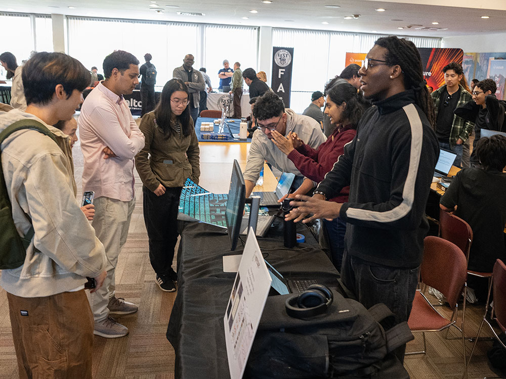 students present research during a conference on campus