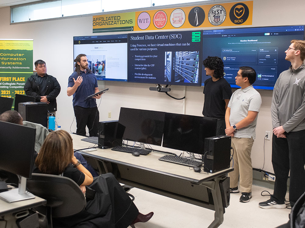 people gathered in the student run operations center