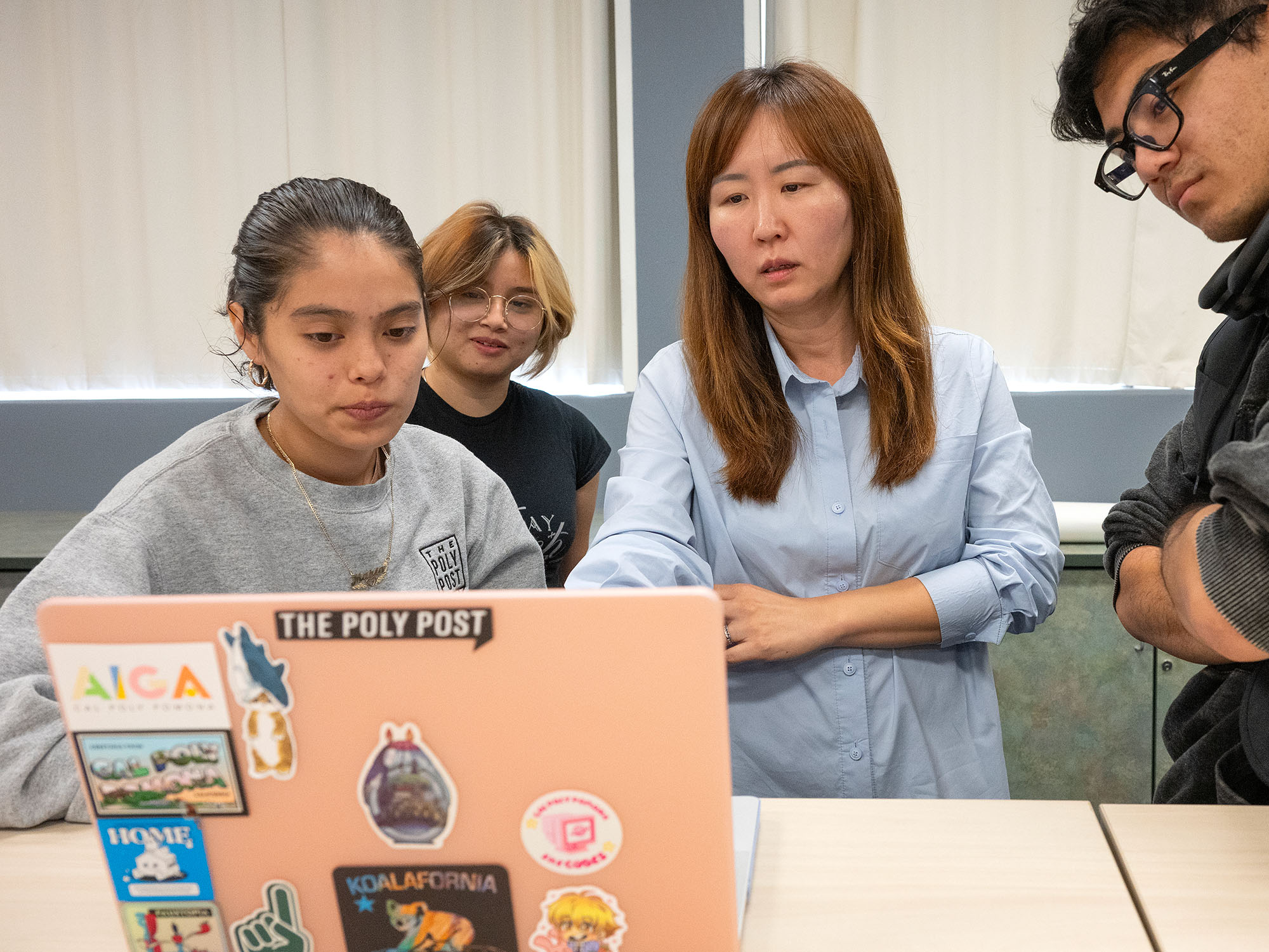 students looking at a laptop