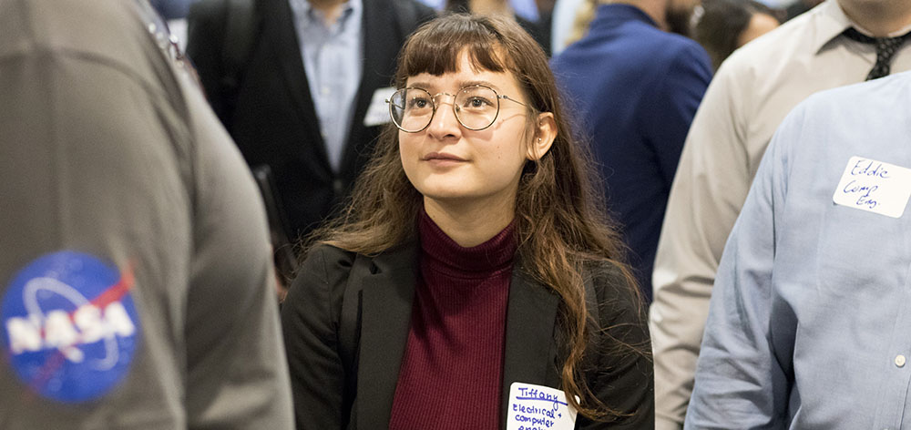 A female engineering student at a job fair