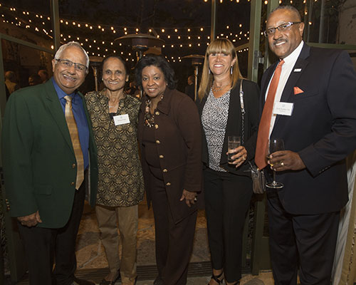 A group photo of two men and three women.