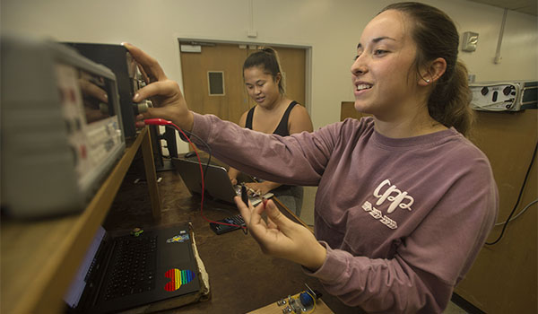 A CPP engineering student working in a lab