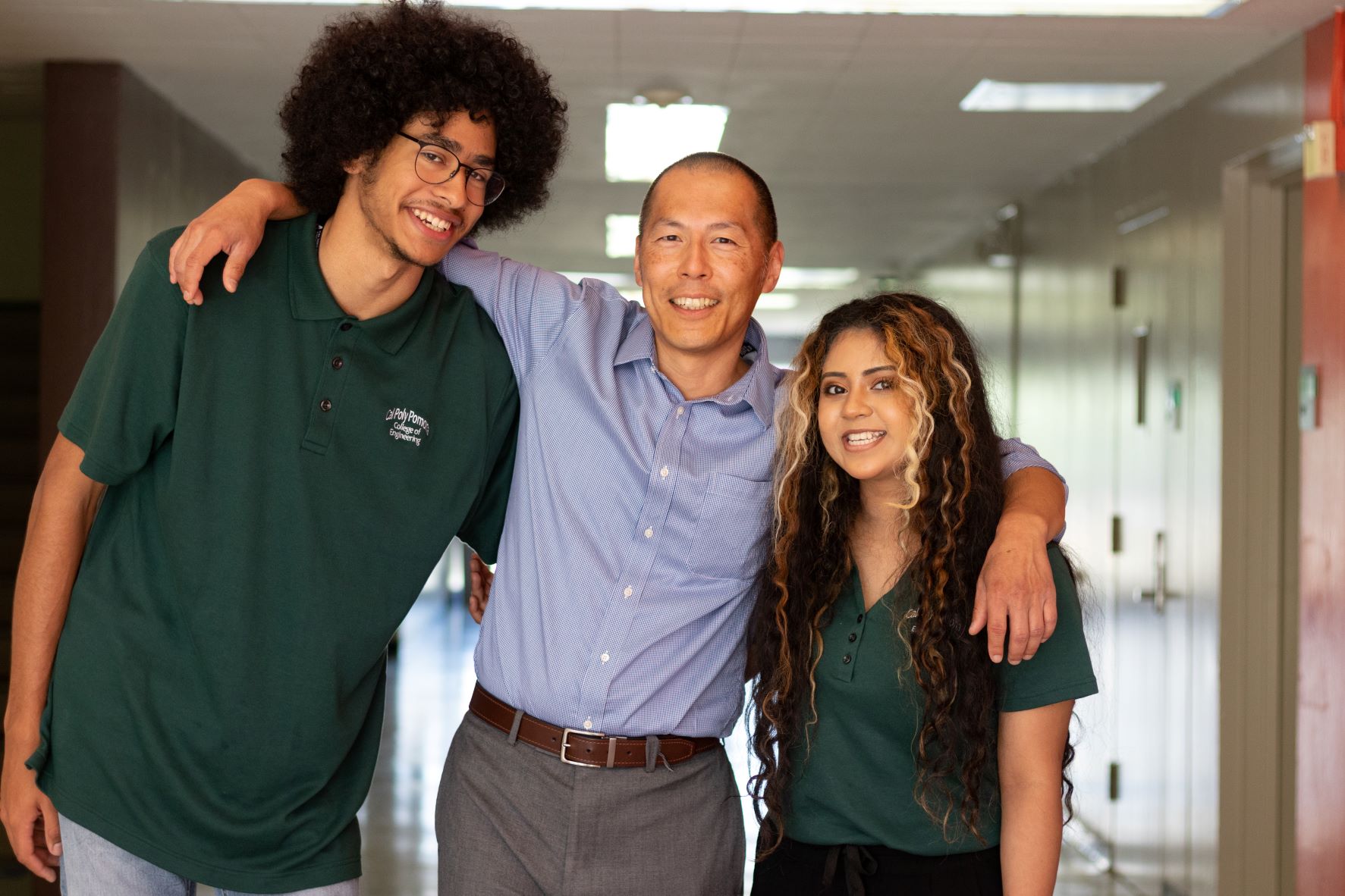 An academic retention staff coordinator with two students.