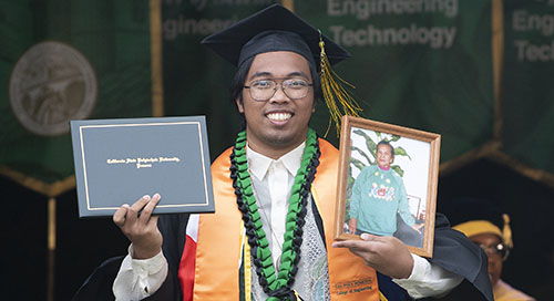 A male student graduating from Cal Poly Pomona