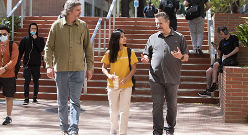 A female student speaking with an alumni