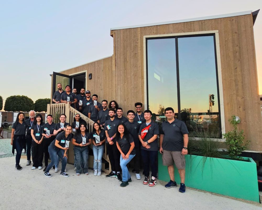 The Cal Poly Pomona Roots House team behind the home they built.