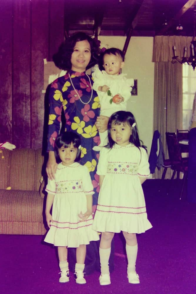 An old photo of a Vietnamese mother with her three daughters.