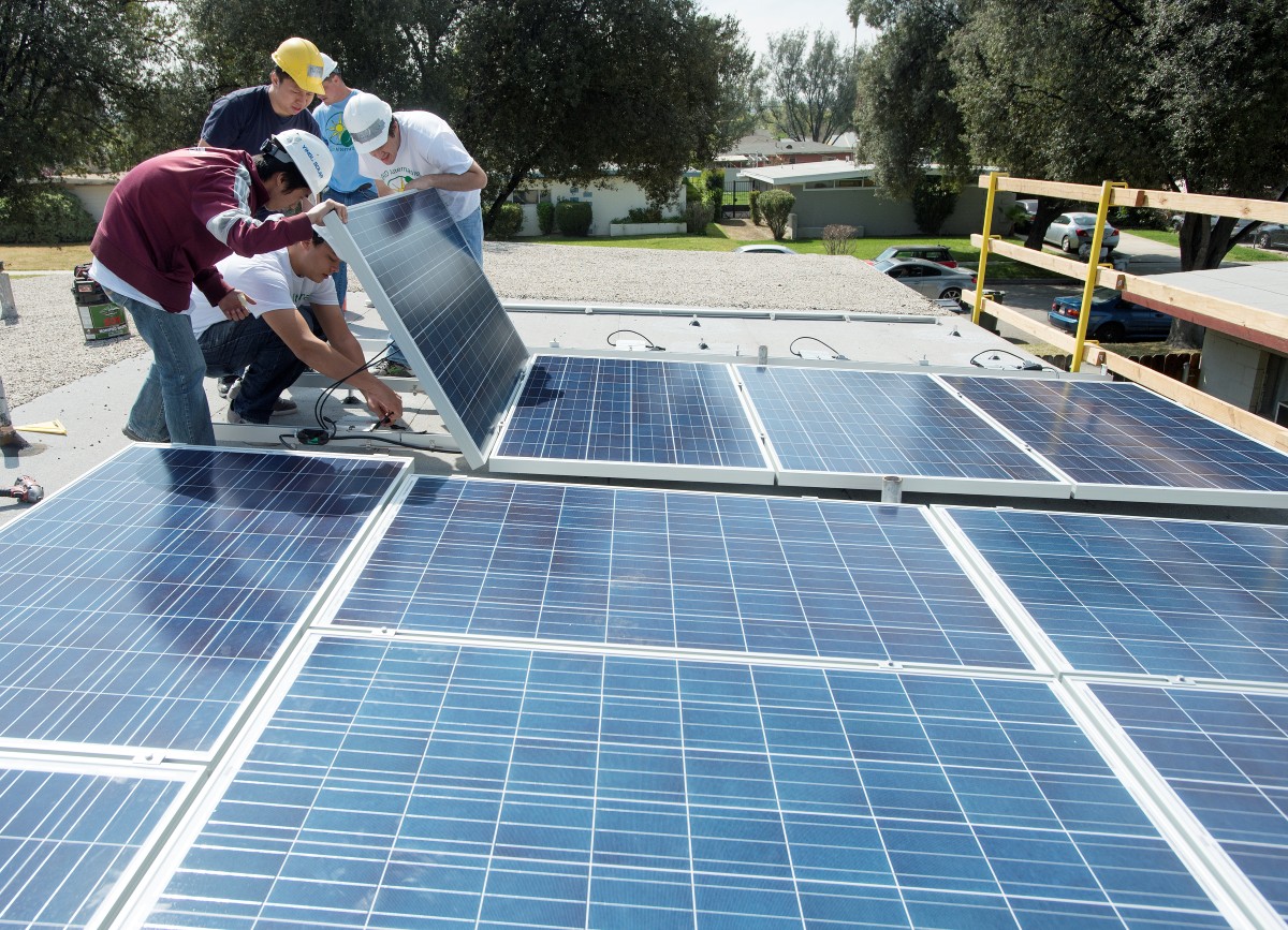 students working on solar panels
