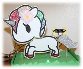 Paper pony connected to an electronic