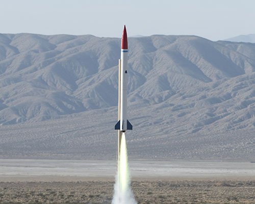 A liquid rocket built be engineering students being launched.