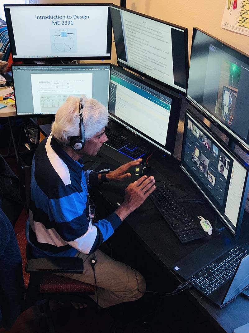 Mariappan Jawaharlal, mechanical engineering professor, teaching virtually with his six-monitor setup.