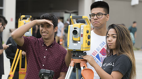 A group of CPP College of Engineering students using a survey tool.