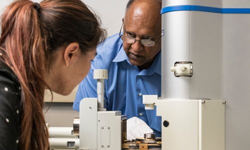 A female engineering student conducting research with Professor Vilupanur Ravi at Cal Poly Pomona's College of Engineering.