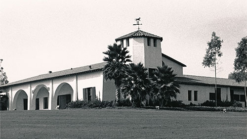 A black and white photo of the CPP horse stables.