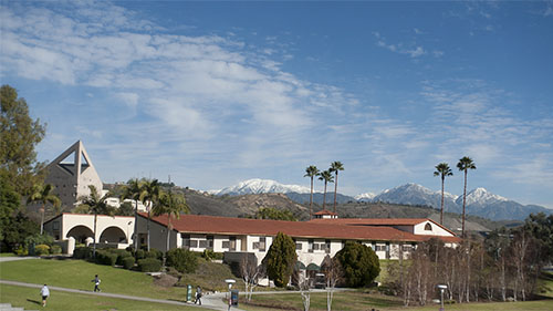 CPP's horse stables with scenic blue skies.