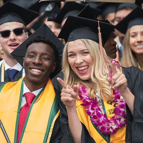 Students smiling at graduation