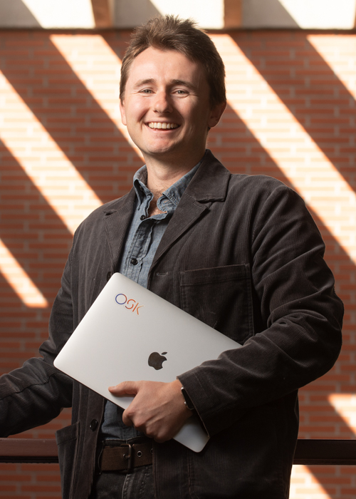 Daniel Aley holding laptop