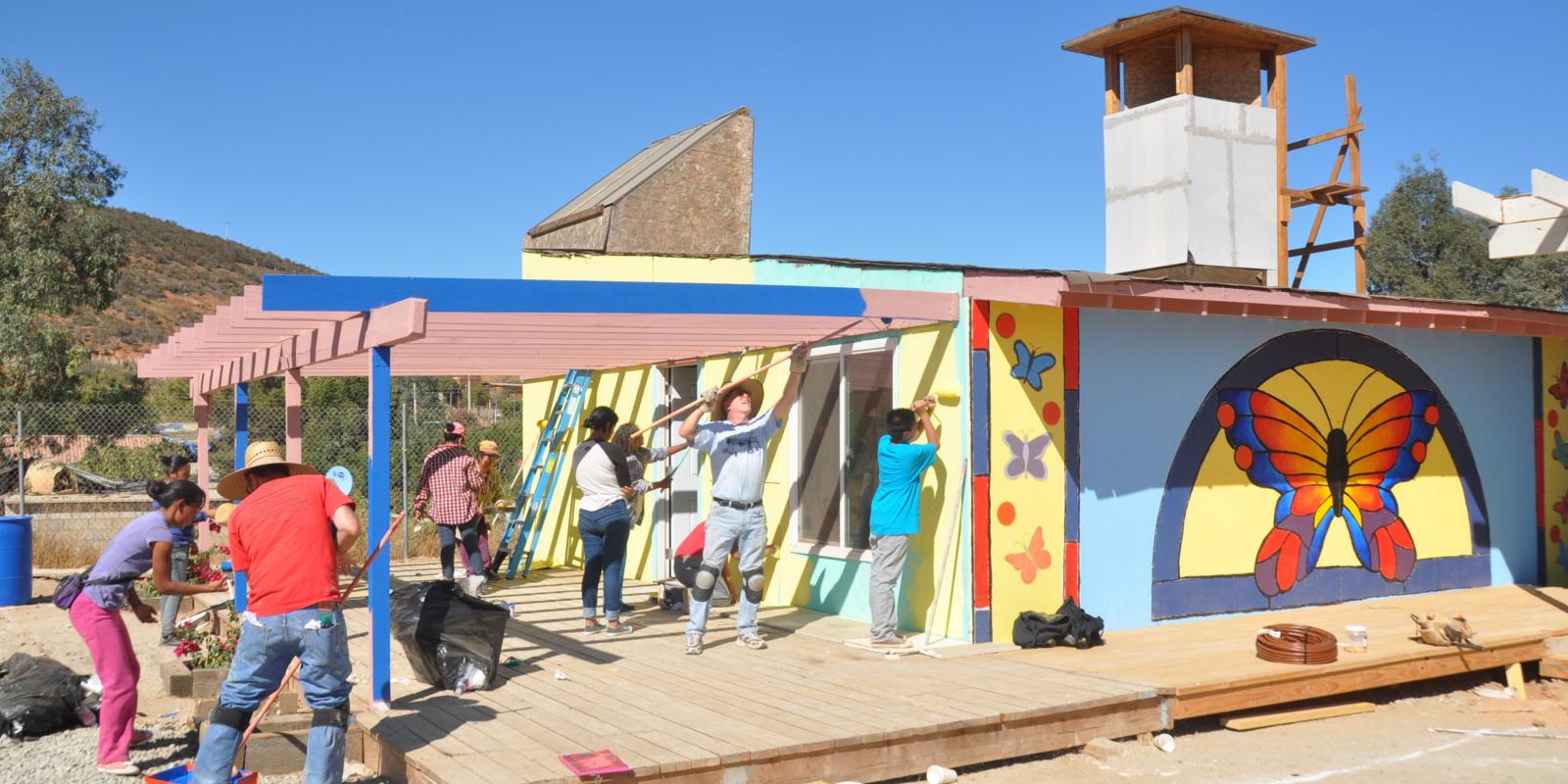 Lyle Center students and Cerro Azul residents building a center