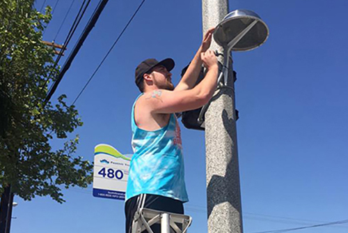 A graduate student installs a smart light system