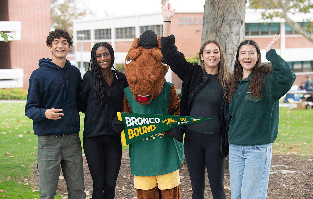 a group of students pose with Billy Bronco during the 2024 Explore CPP day.