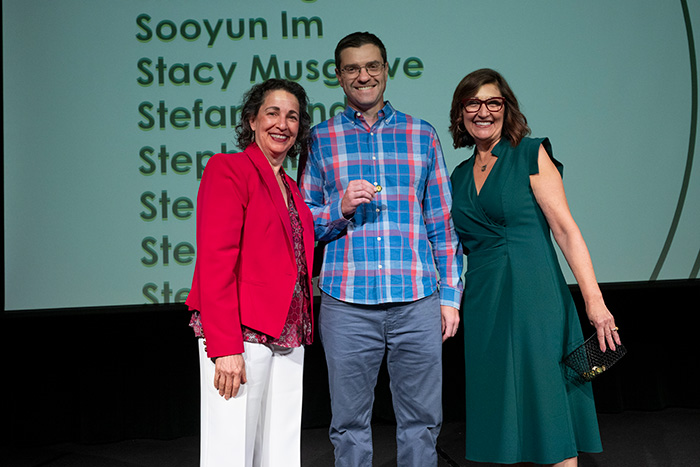 Alex Mavda receives a pin during the 2025 recognition of service awards. 