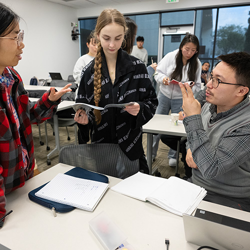 Students interact in class. 