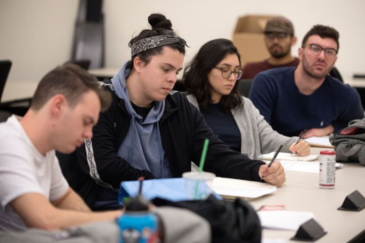 Students take notes during a lecture