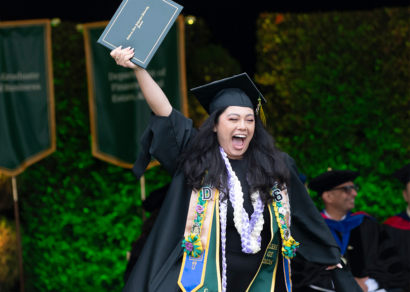 Cal Poly Pomona student graduating on stage