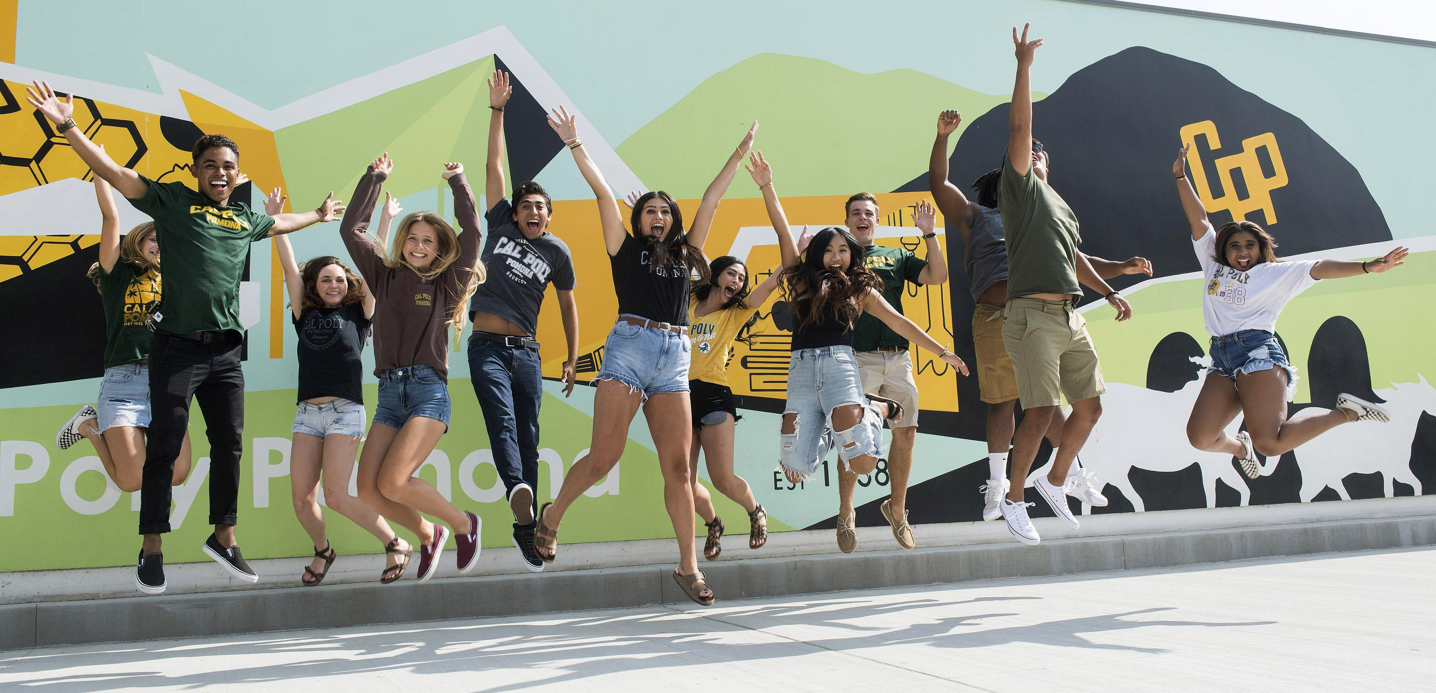 CPP students jumping together