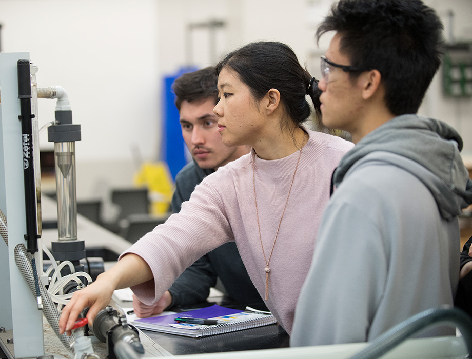 Three students working together in the ME 3131 Lab