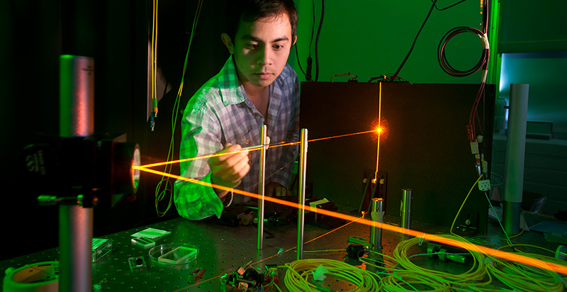 student working in a physics lab