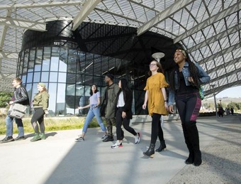 students walking by the Student Services Building