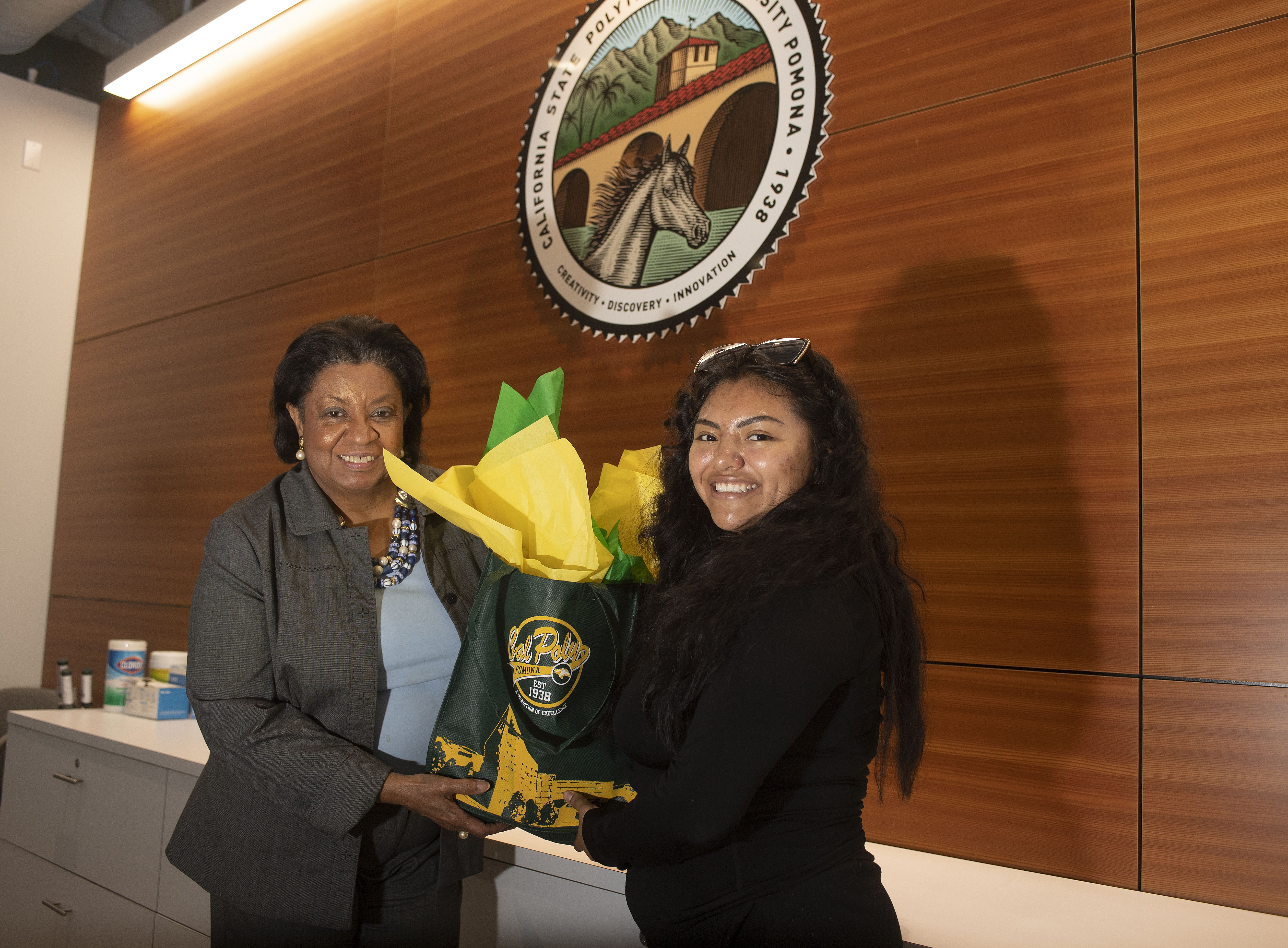 CSU Student Trustee Diana Aguilar-Cruz receives welcome gift from President Coley
