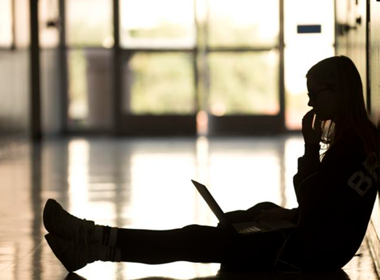 A student's silhouette