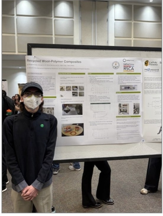 Robert Kimble posing in front of his research poster.