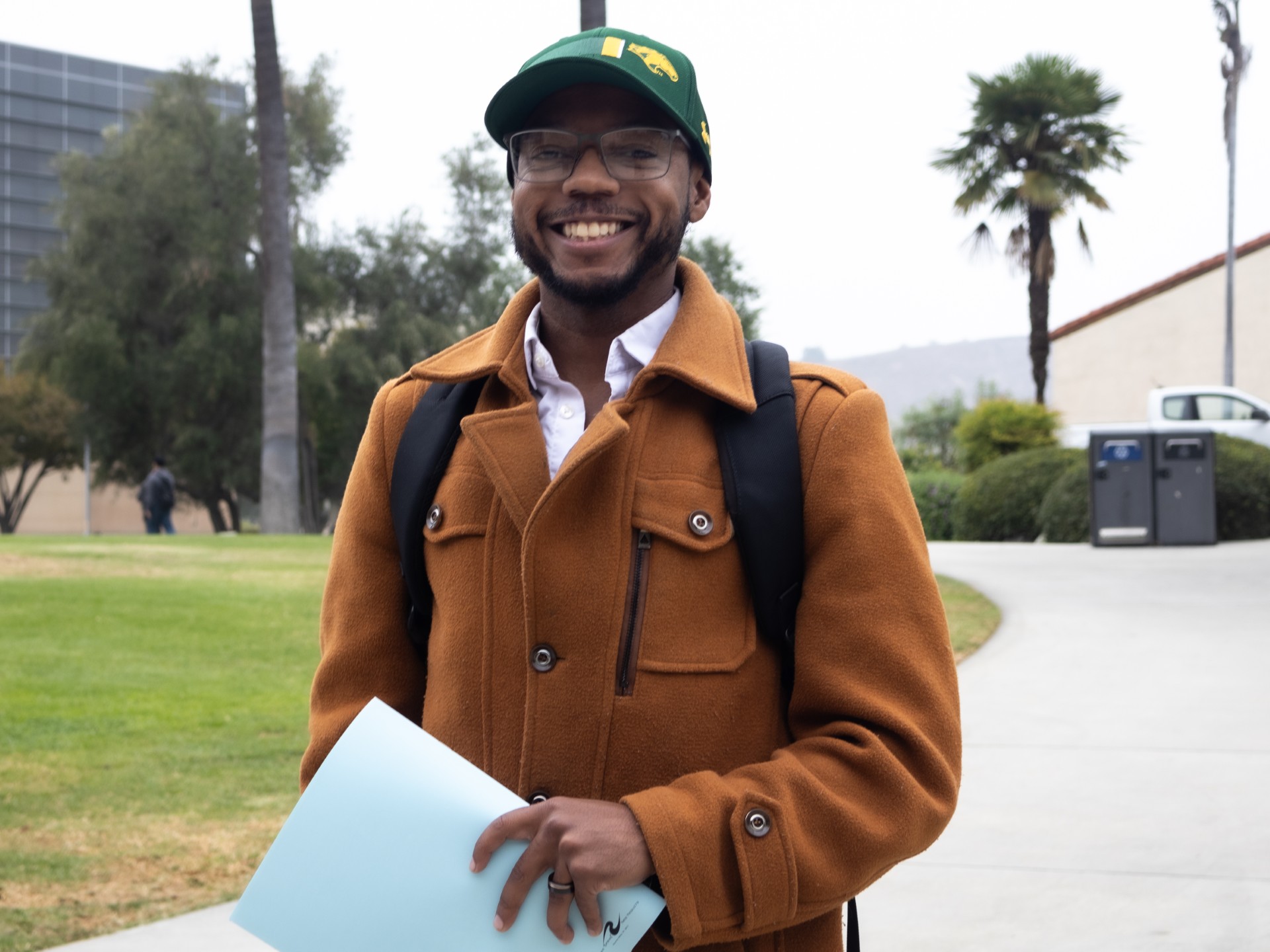 Devin McGee smiling on campus.