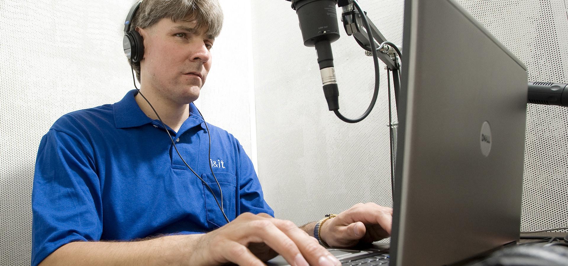 person using assistive technology to read a book out loud