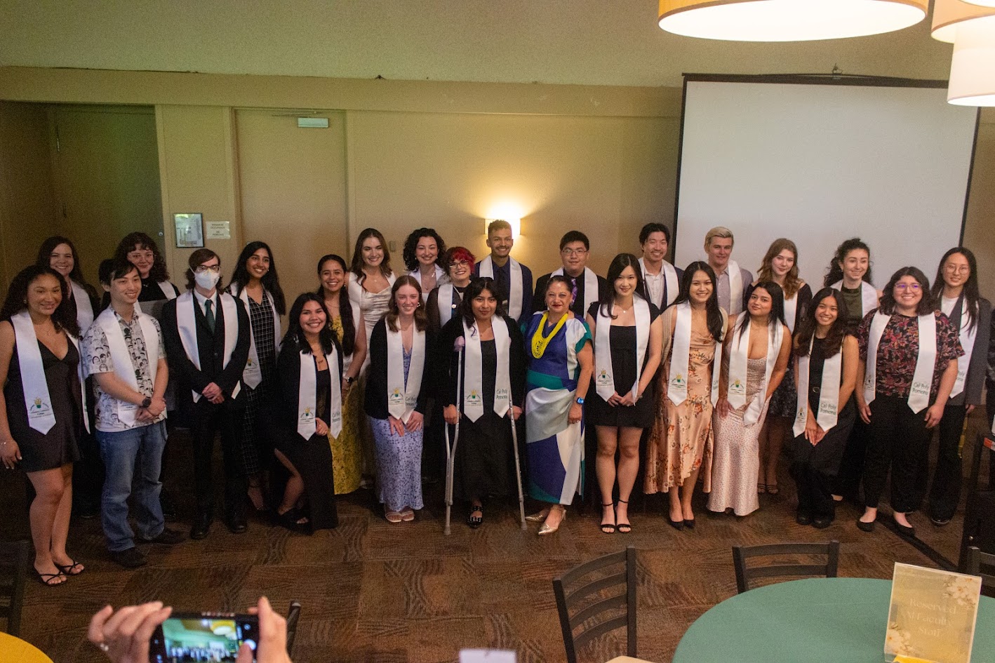Group of students taking a picture wearing 