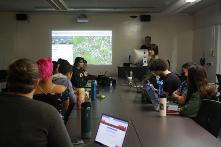 Students in a class looking at a presenter