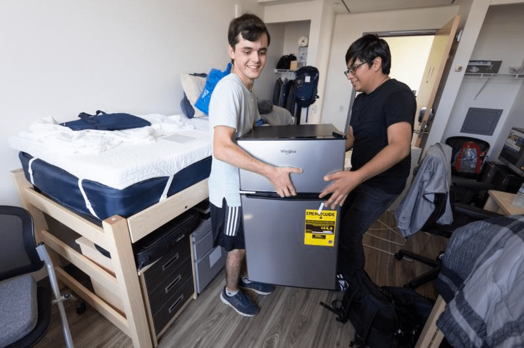 Image of two residents moving in