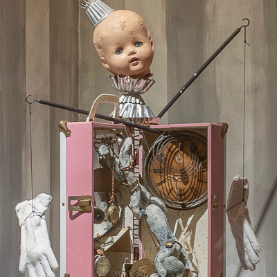 Gina M.  Ever After from the Toy Box Kids Series, 2017  assemblage, found objects, ceramic gloves and rabbit  30.5 x 23 x 12”  Courtesy of the artist